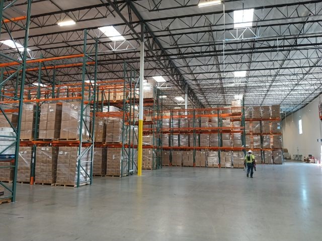 Wide view of the new warehouse facility before racking installation
